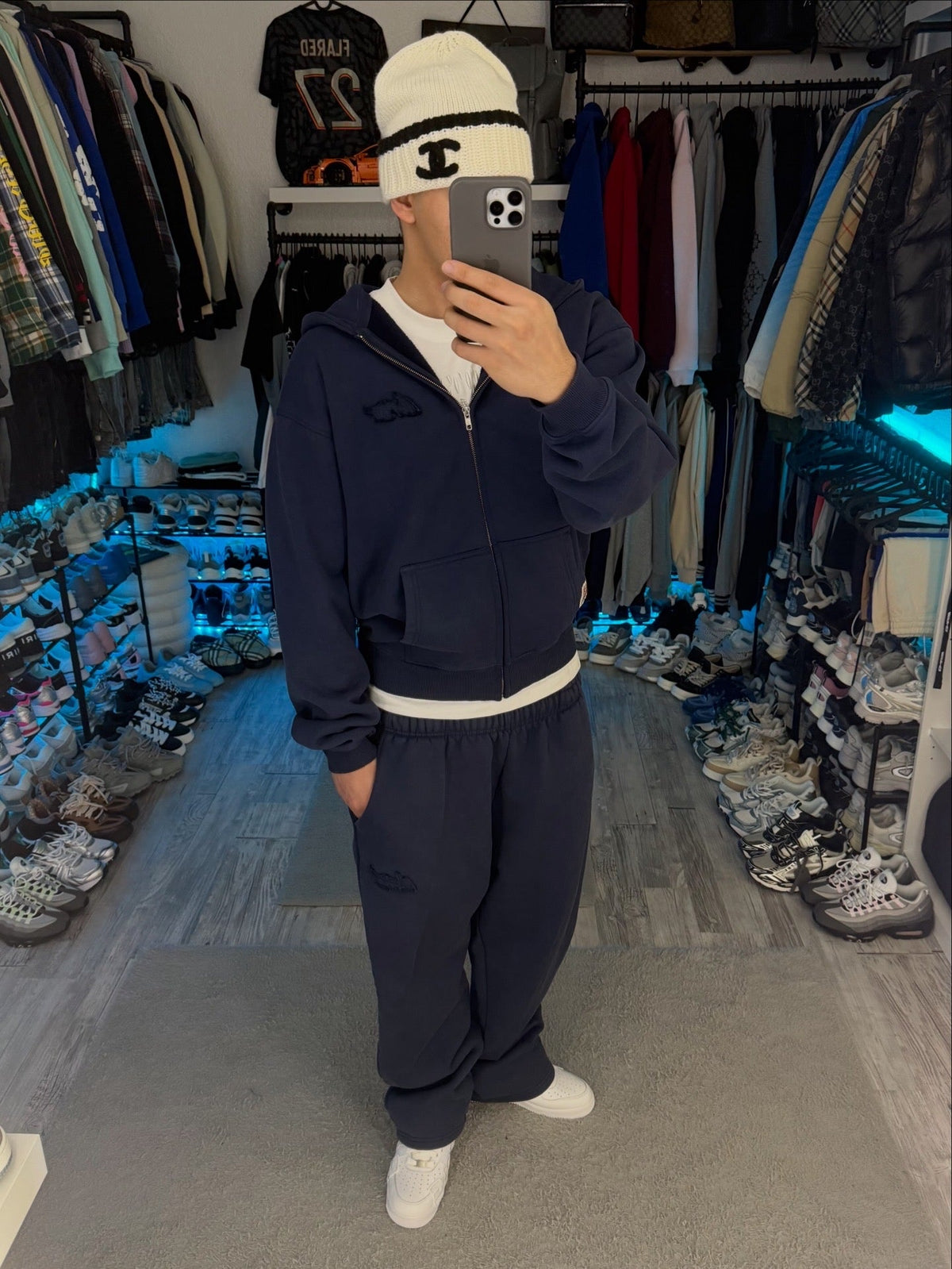 Navy long-sleeve zip hoodie with hood and front pouch pockets