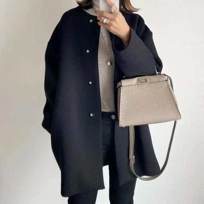 Women's relaxed fit long coat with round neck, long sleeves and snap buttons