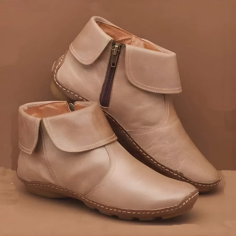 Women's ankle boots with fold-over collars, side zips, rounded toes and low heels