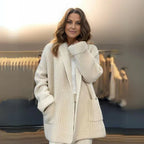 Women's longline textured knitted cardigan with open front, long sleeves and two front pockets