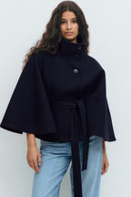 Women's cape coat with high collar, button front and tied waist belt