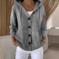 Women's hooded knitted cardigan with buttons, long sleeves and front pockets