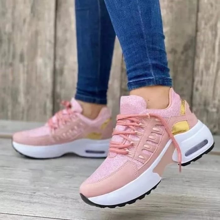 Women's low-top lace-up trainers with textured panels and chunky soles