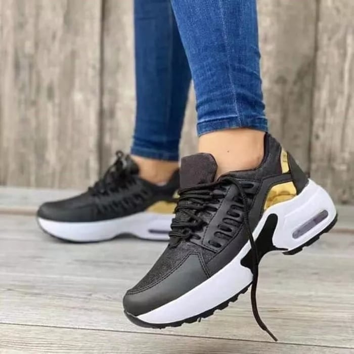Women's low-top lace-up trainers with textured panels and chunky soles