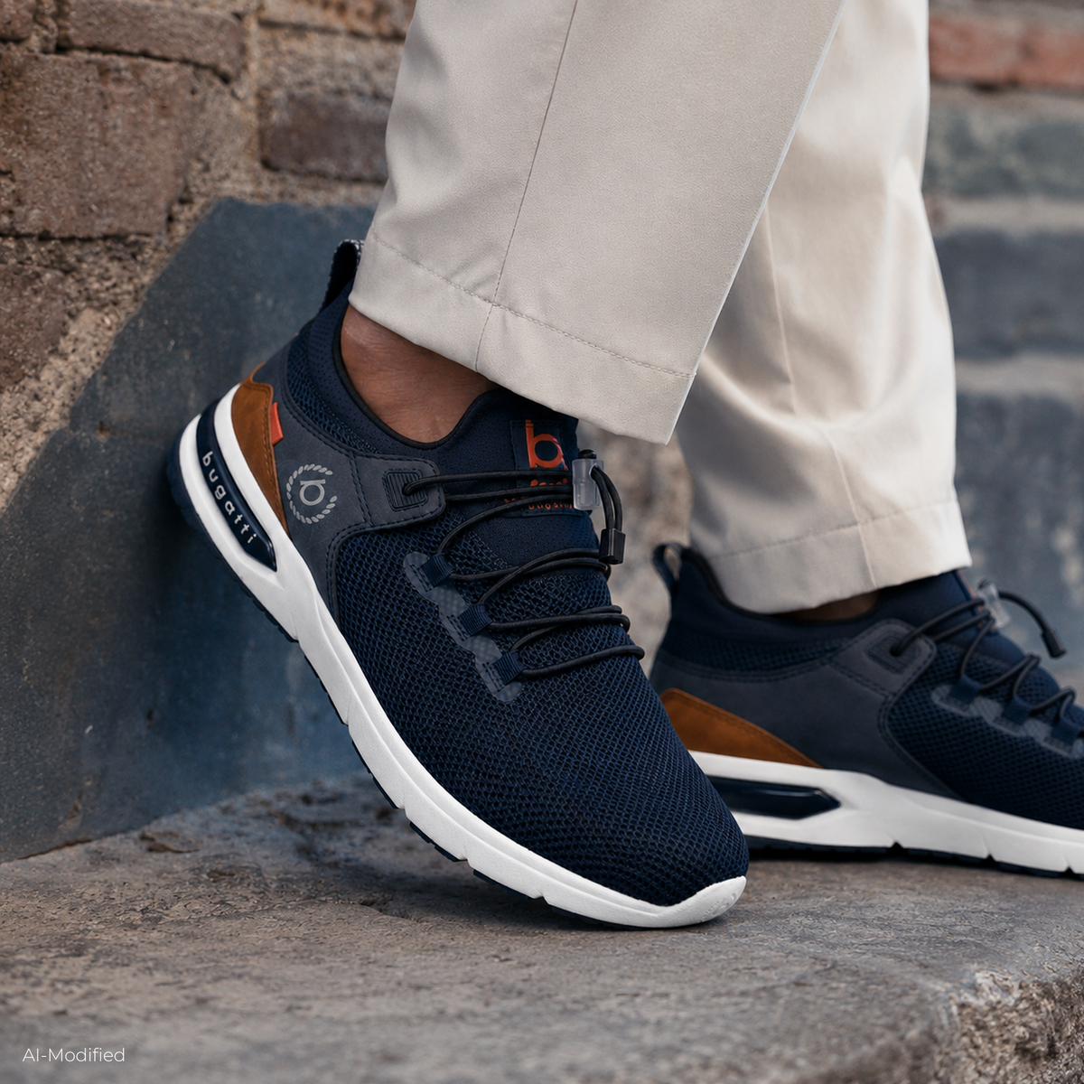 Men's navy trainers with toggle laces, white sole and brown heel panel