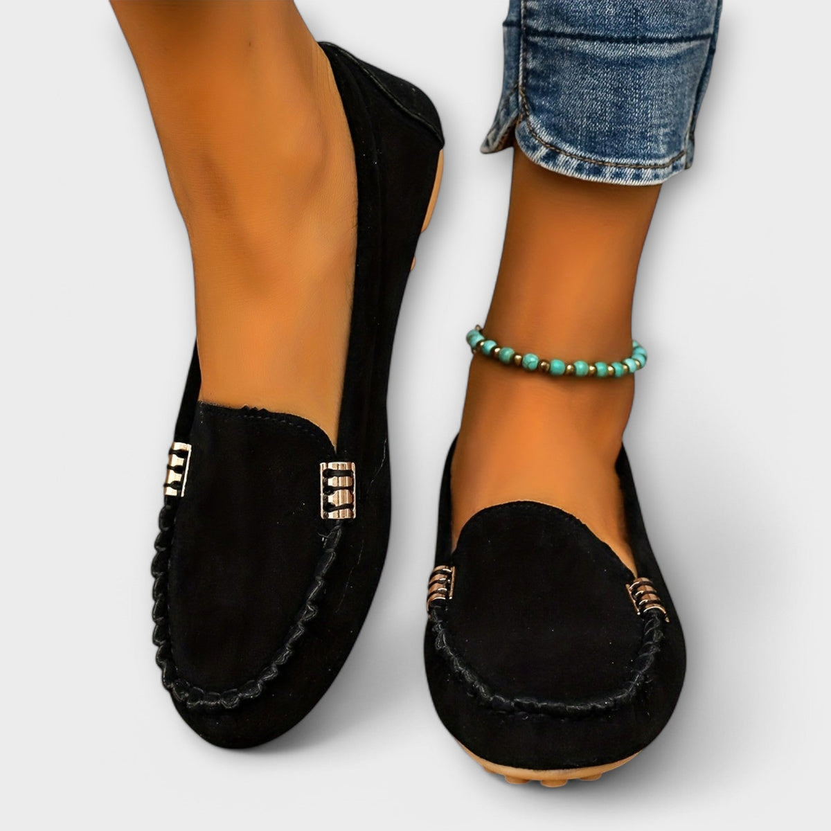 Slip-on loafers with rounded toes, braided stitching and metallic side details