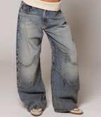 Women's washed blue wide-leg jeans with contrasting curved denim panels