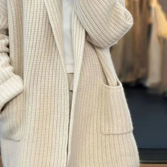 Women's longline textured knitted cardigan with open front, long sleeves and two front pockets