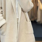 Women's longline textured knitted cardigan with open front, long sleeves and two front pockets