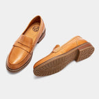 Men's slip-on penny loafers with rounded toes, stitched soles and low flat heels