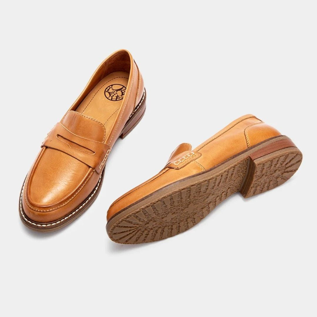 Men's slip-on penny loafers with rounded toes, stitched soles and low flat heels
