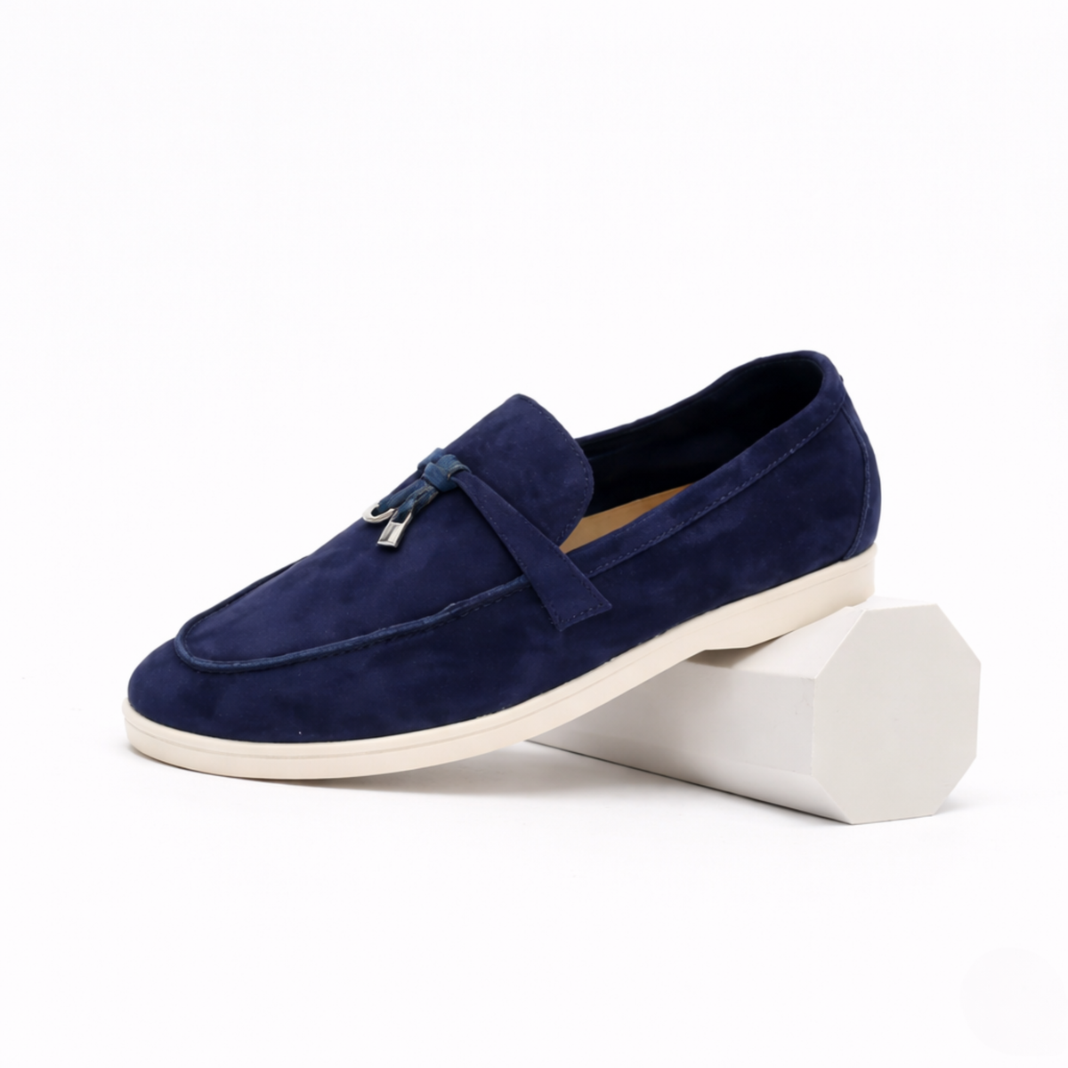 Women's classic slip-on loafer with rounded toe, flat sole and decorative metal trim