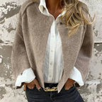 Women's cropped collarless jacket with long sleeves and button detail