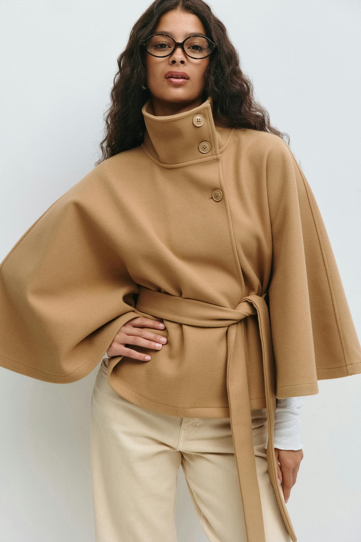 Women's cape coat with high collar, button front and tied waist belt