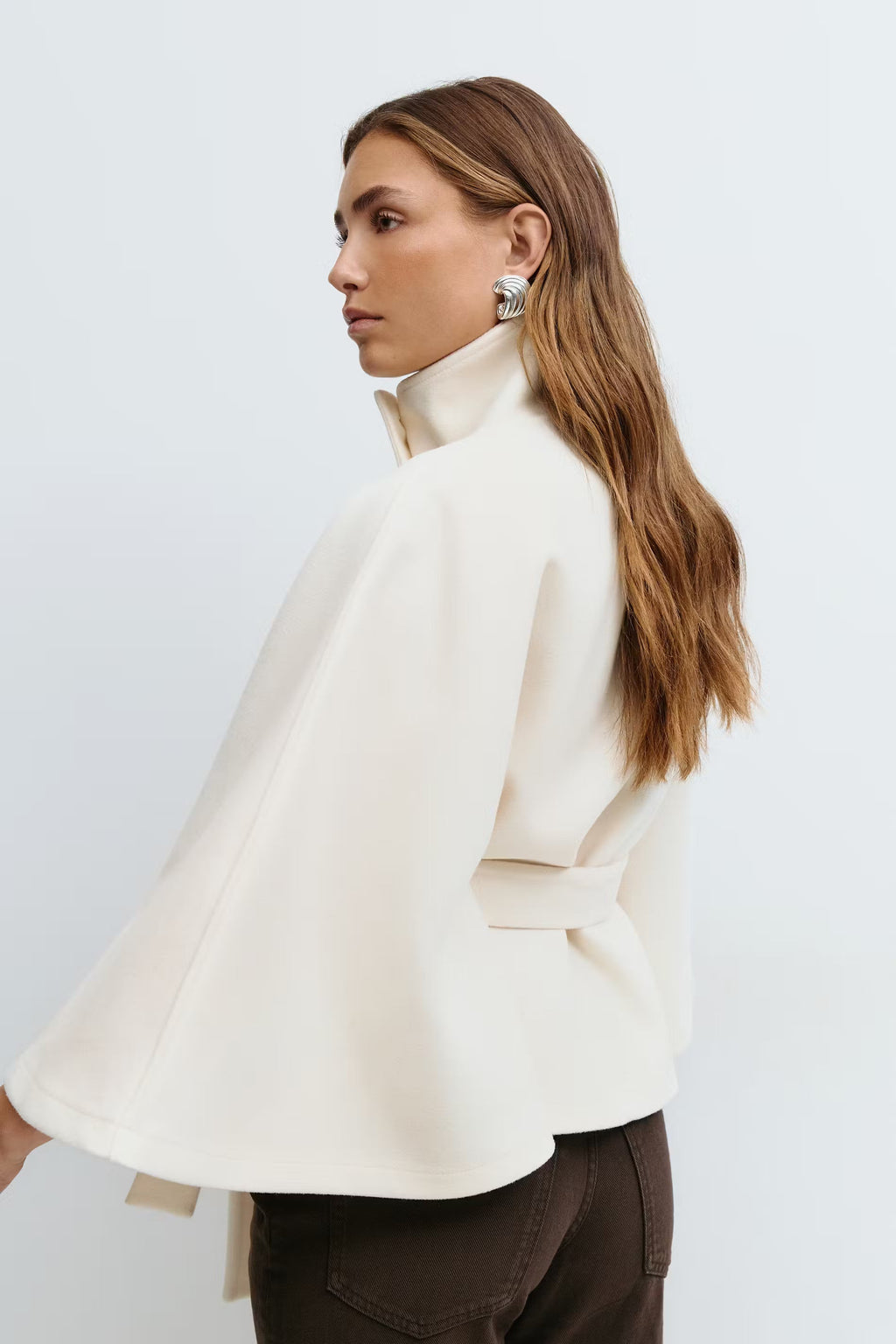 Women's cape coat with high collar, button front and tied waist belt