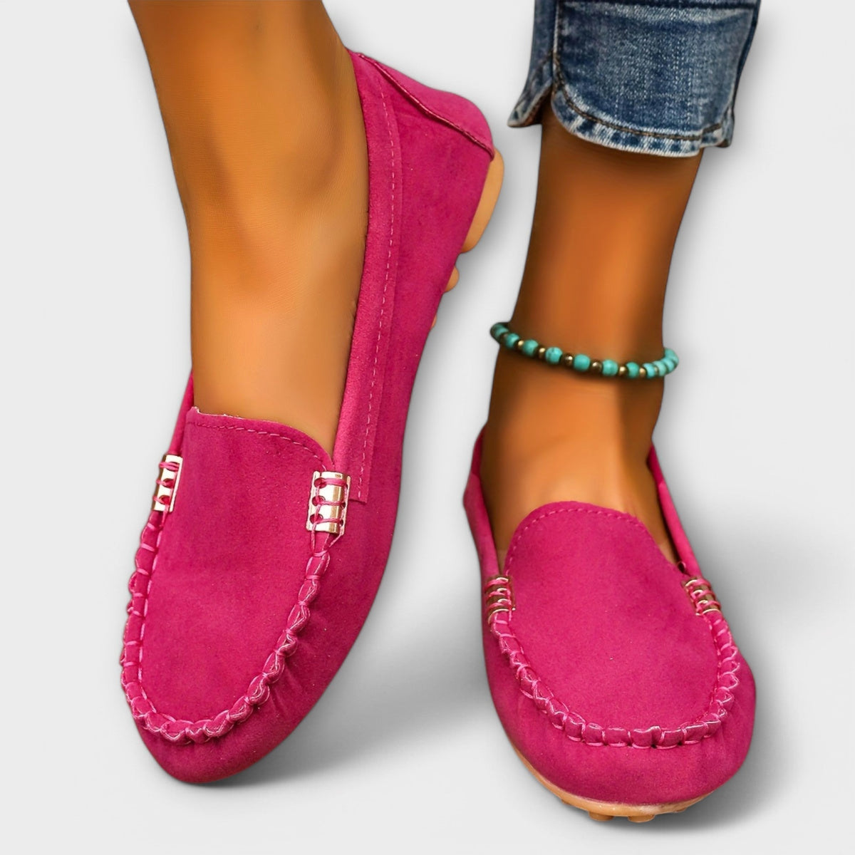 Slip-on loafers with rounded toes, braided stitching and metallic side details
