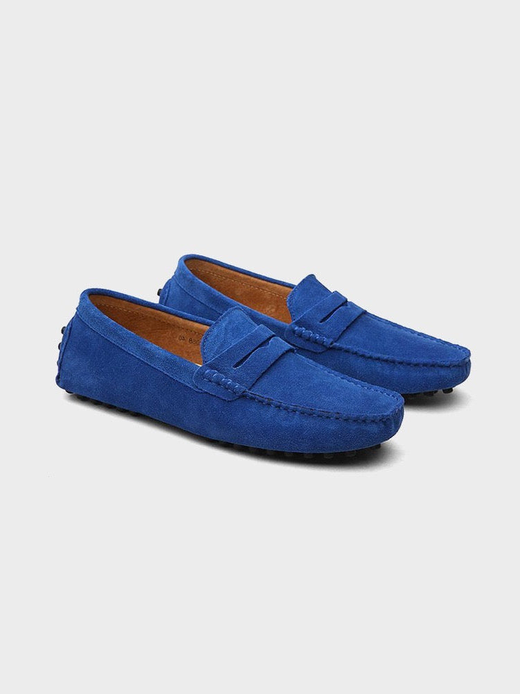 Suede boat loafers with moc toe stitching and slip-on strap detail
