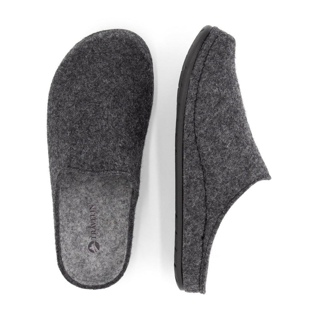 Grey closed-toe house slippers with textured uppers and black flat soles