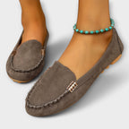 Slip-on loafers with rounded toes, braided stitching and metallic side details