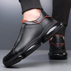 Black men's slip-on athletic trainers with chunky sculpted soles