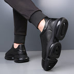 Black men's slip-on athletic trainers with chunky sculpted soles