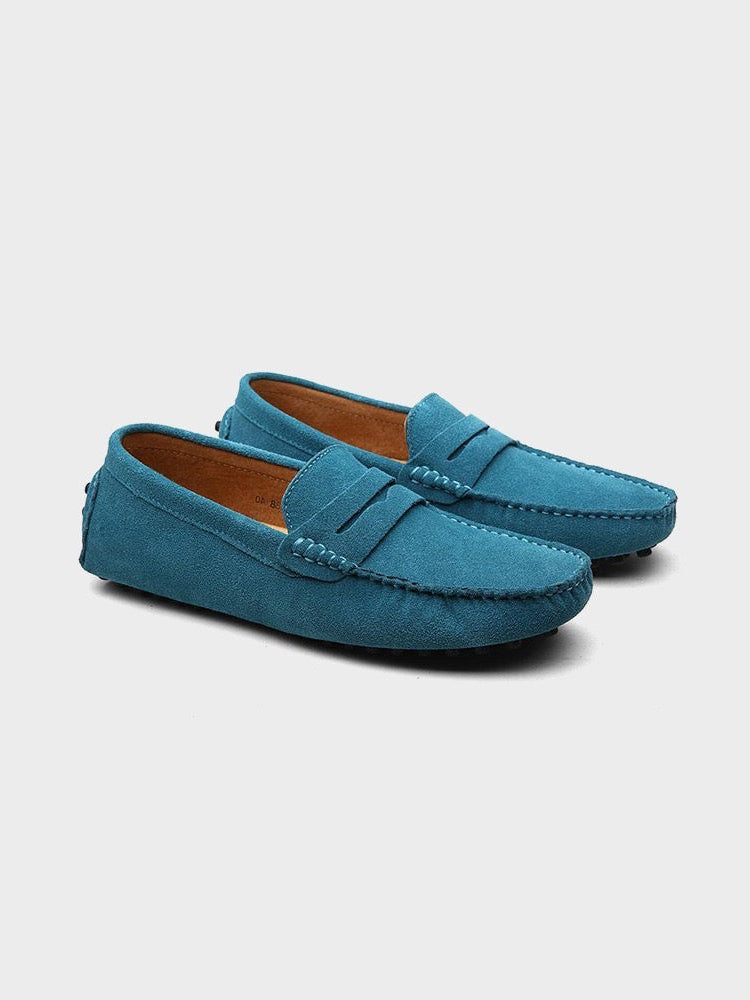 Suede boat loafers with moc toe stitching and slip-on strap detail