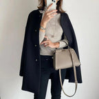 Women's relaxed fit long coat with round neck, long sleeves and snap buttons