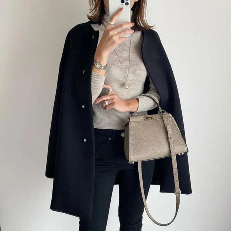 Women's relaxed fit long coat with round neck, long sleeves and snap buttons