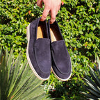 Black men's moccasin loafers with rounded toes and light flat soles