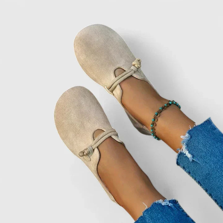 Women's slip-on loafers with rounded toes, rope trim and flat soles