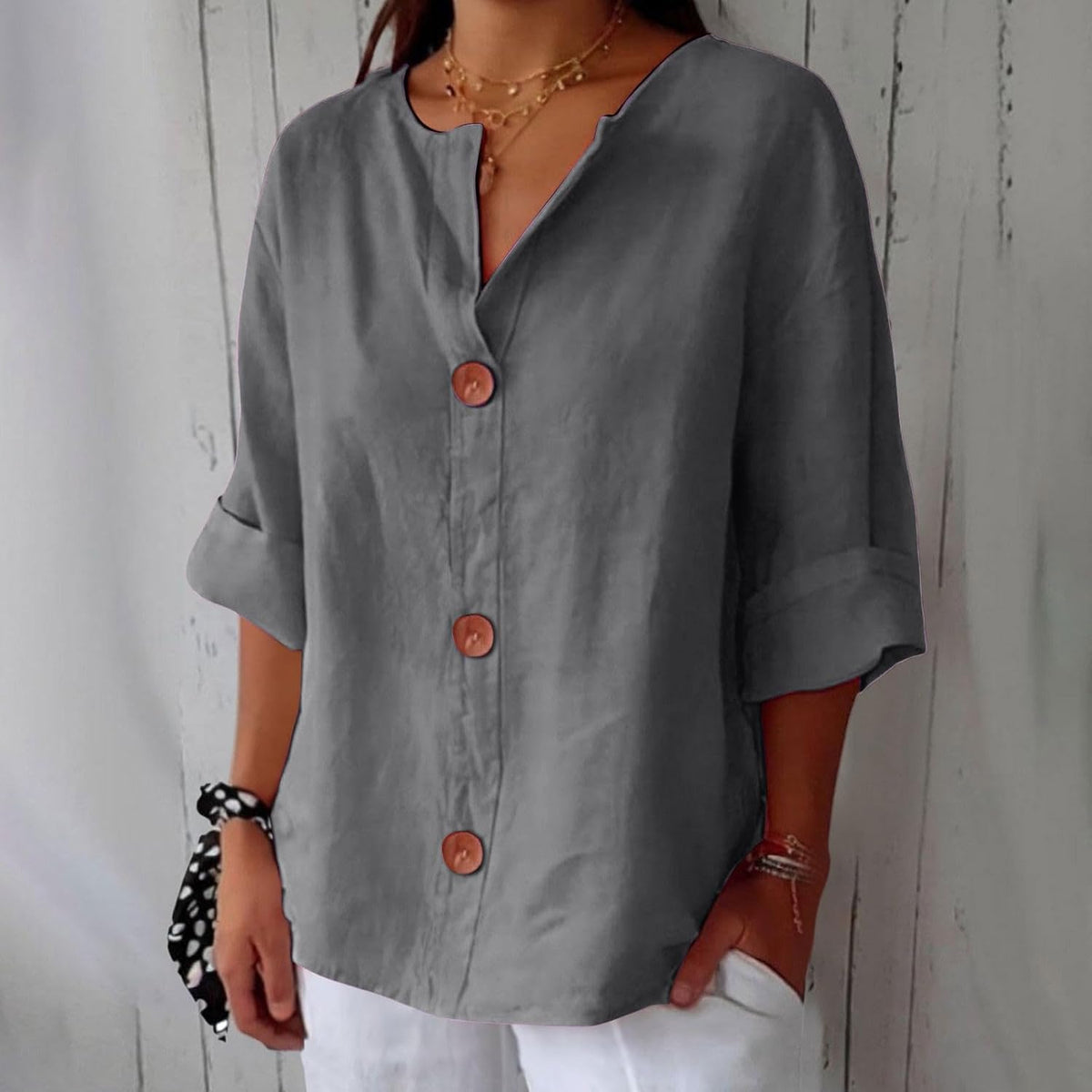 Women's plain V-neck shirt with front buttons and three-quarter sleeves