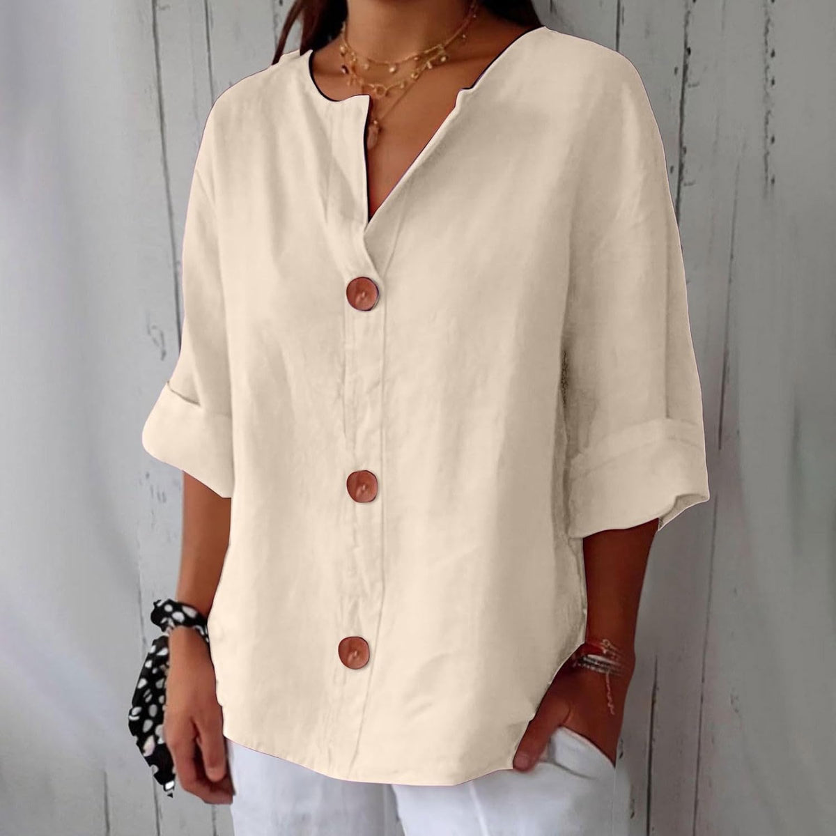Women's plain V-neck shirt with front buttons and three-quarter sleeves