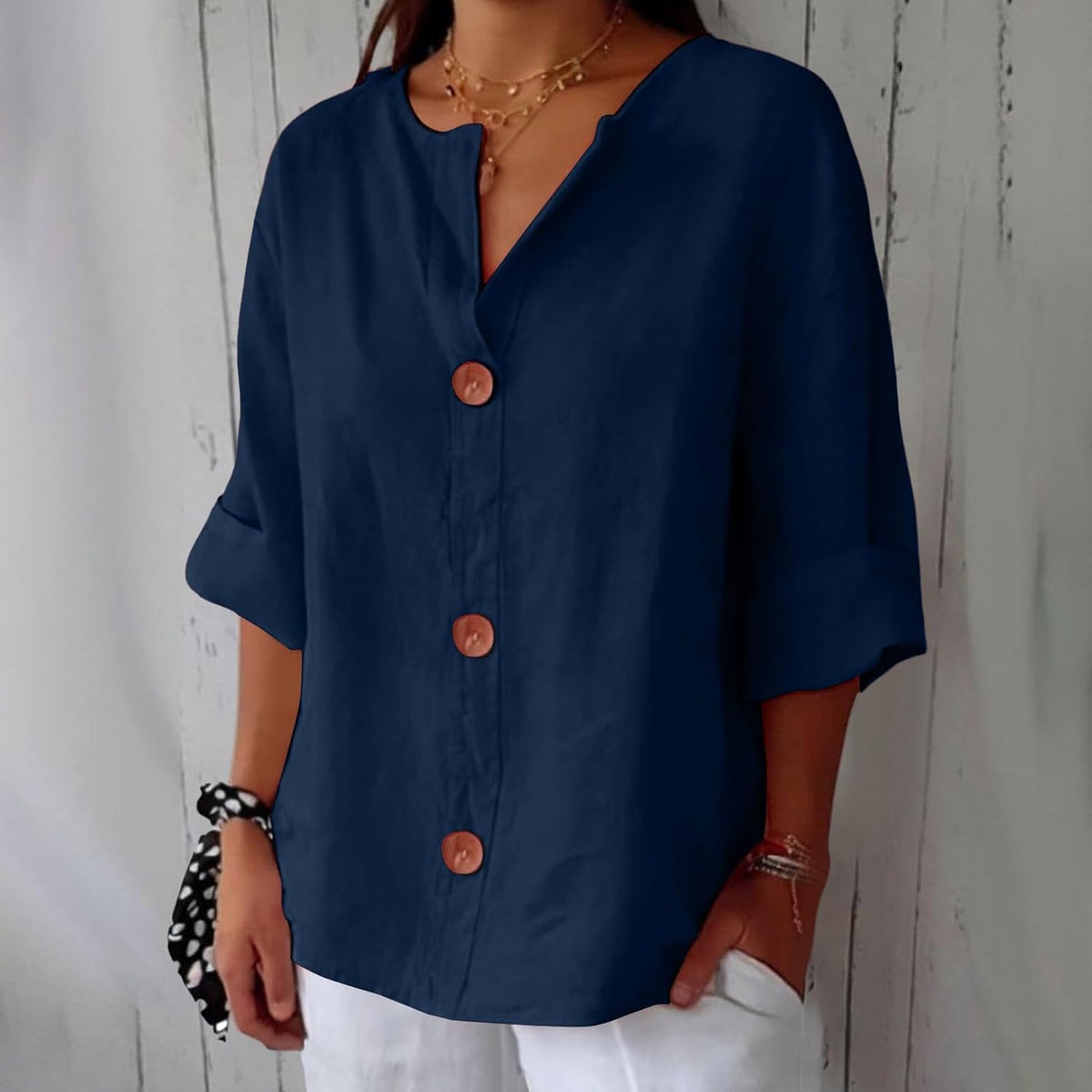 Women's plain V-neck shirt with front buttons and three-quarter sleeves