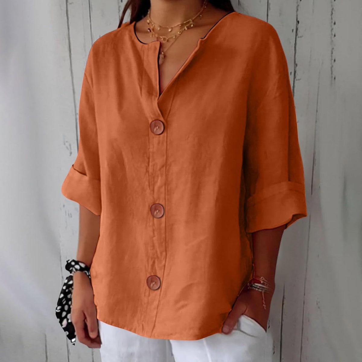 Women's plain V-neck shirt with front buttons and three-quarter sleeves
