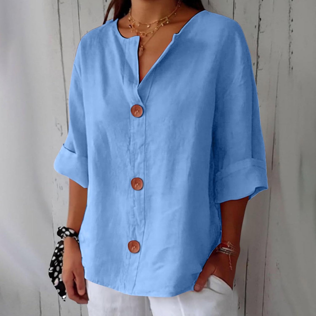 Women's plain V-neck shirt with front buttons and three-quarter sleeves