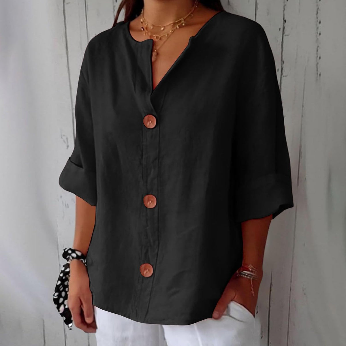 Women's plain V-neck shirt with front buttons and three-quarter sleeves