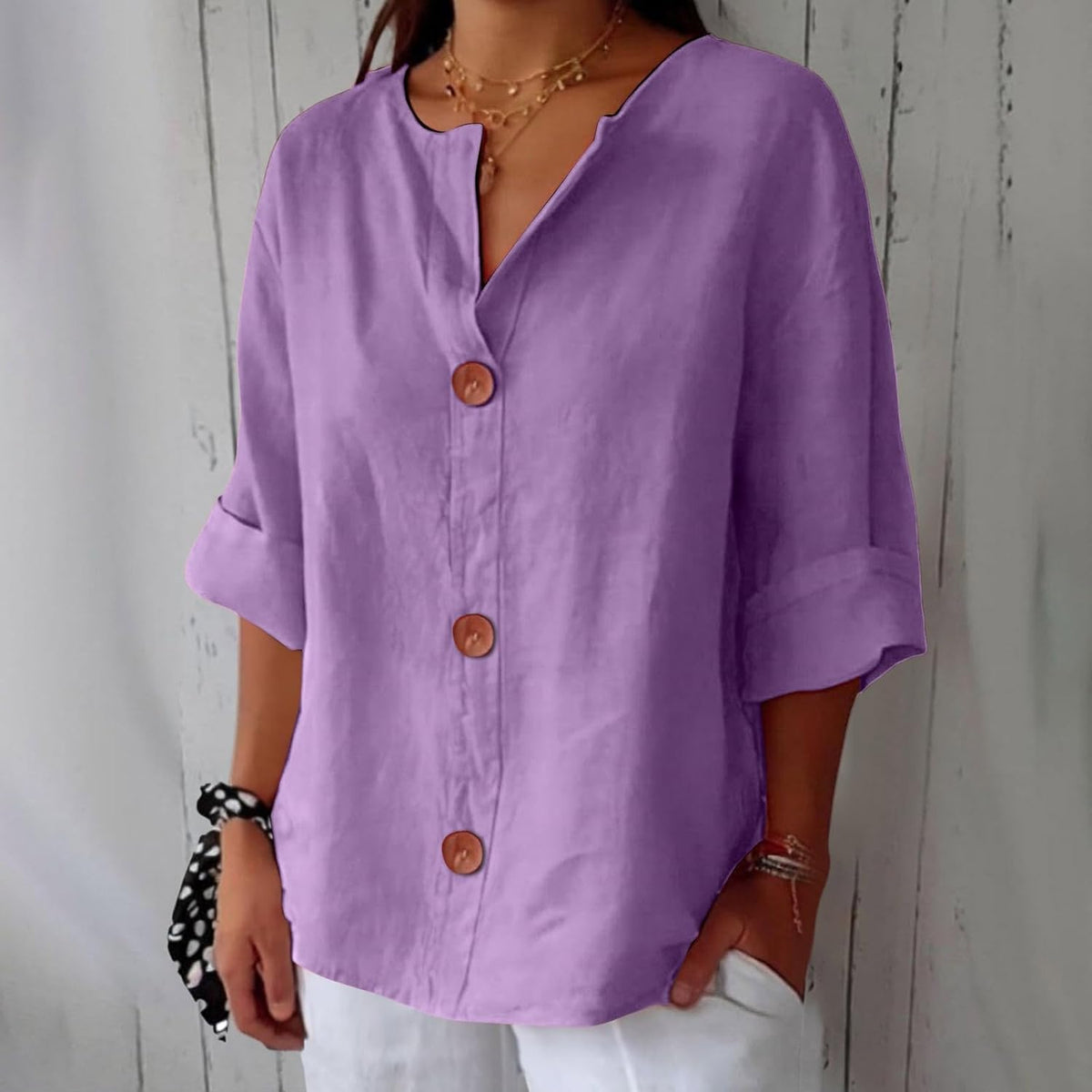 Women's plain V-neck shirt with front buttons and three-quarter sleeves