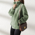 Women's plush fleece jacket with high collar, long sleeves and front zip