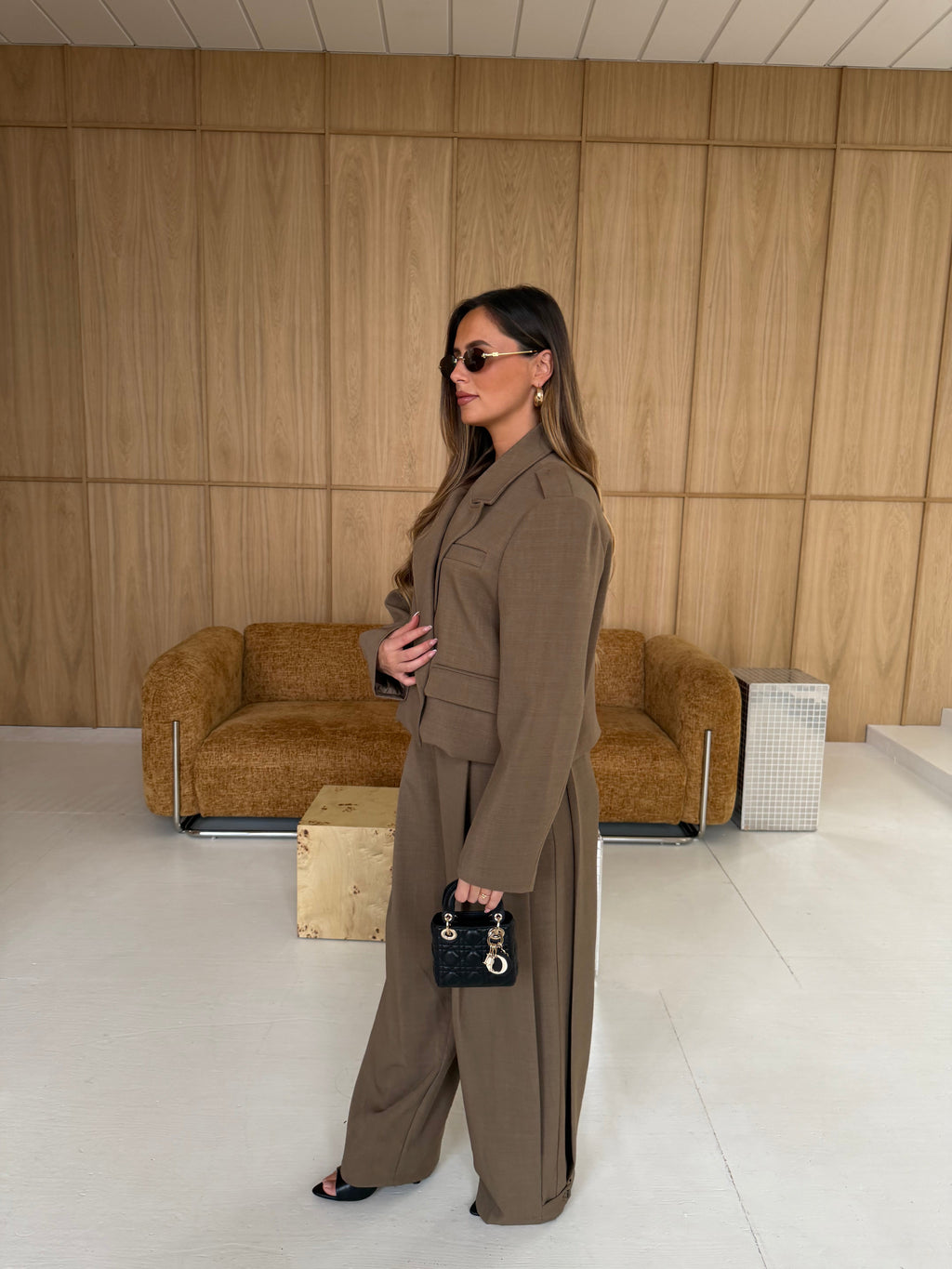 Women's taupe tailored blazer with notch lapels, long sleeves and flap pockets