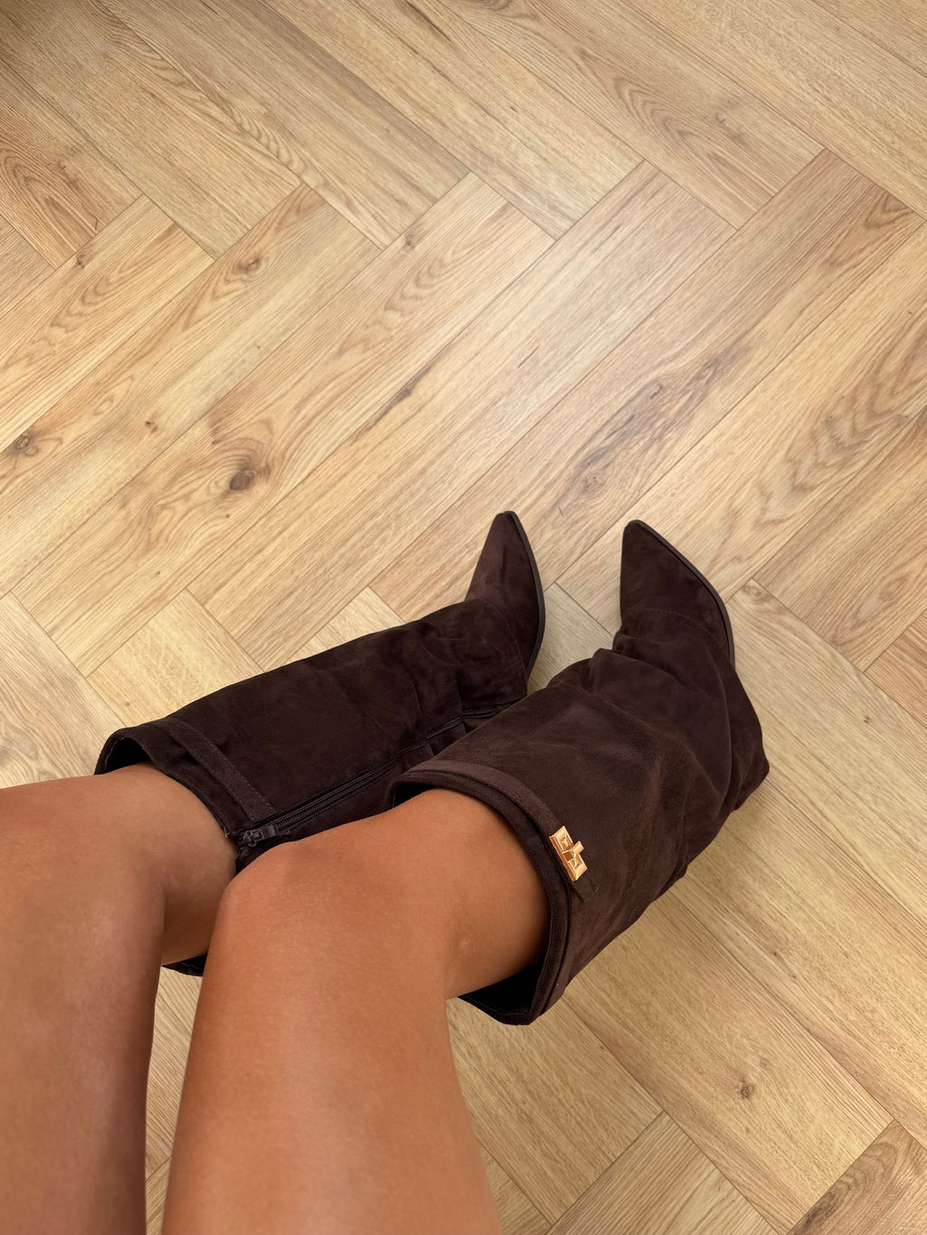 Women's dark brown knee-high pointed-toe boots with buckle strap and low heel