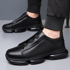 Black men's slip-on athletic trainers with chunky sculpted soles