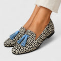 Women's animal print loafers with blue tassel trims and low heels