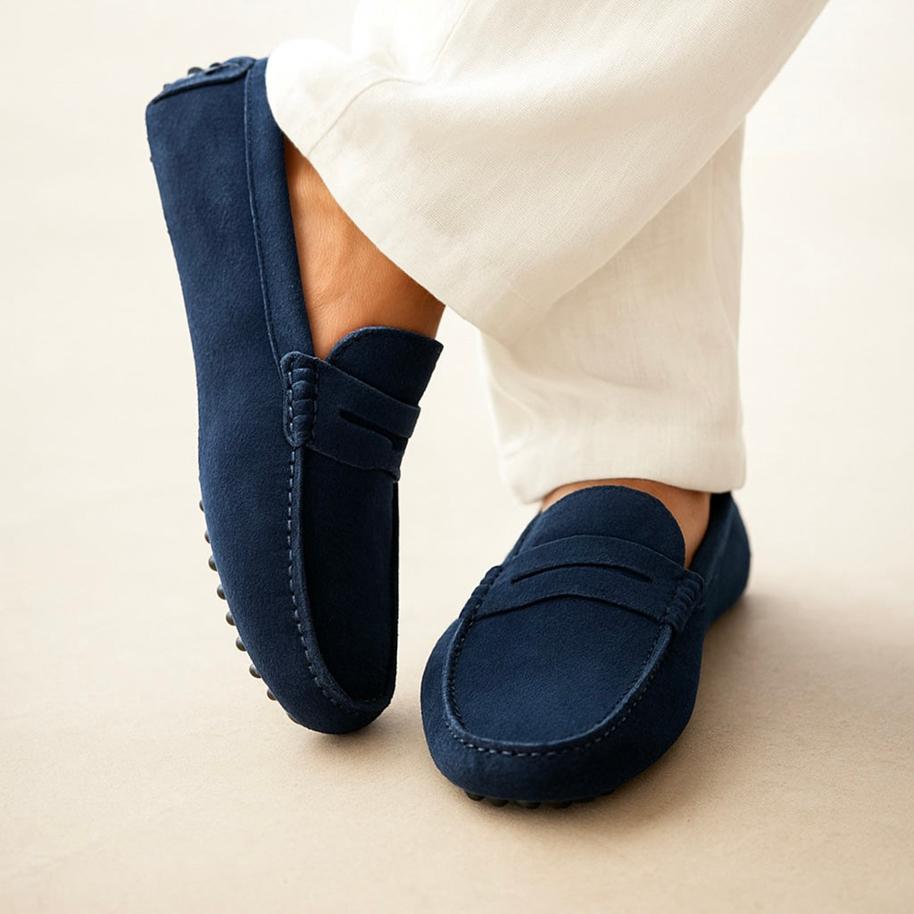 Suede boat loafers with moc toe stitching and slip-on strap detail