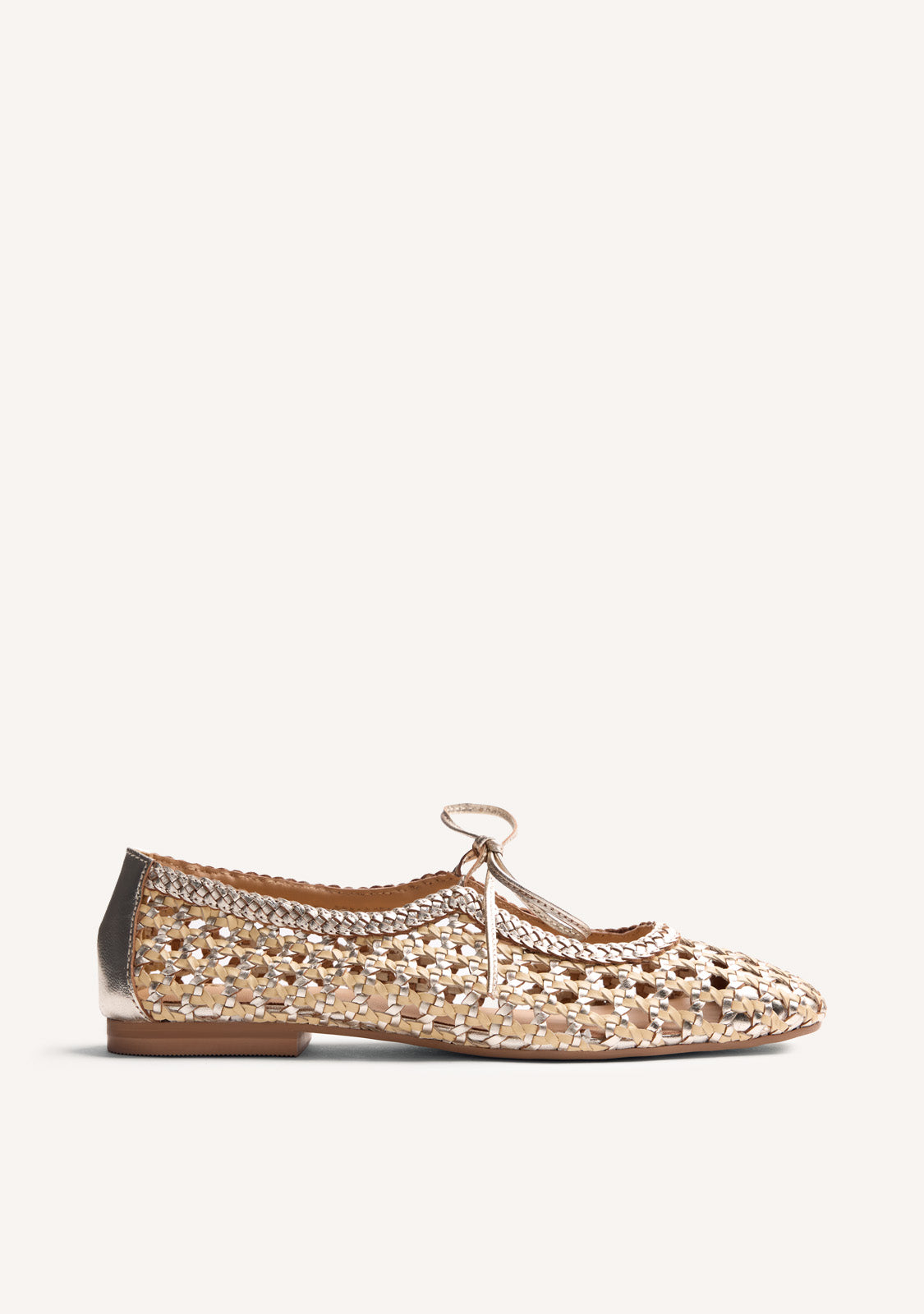 Gold woven ballet flats with ankle tie straps and low heels