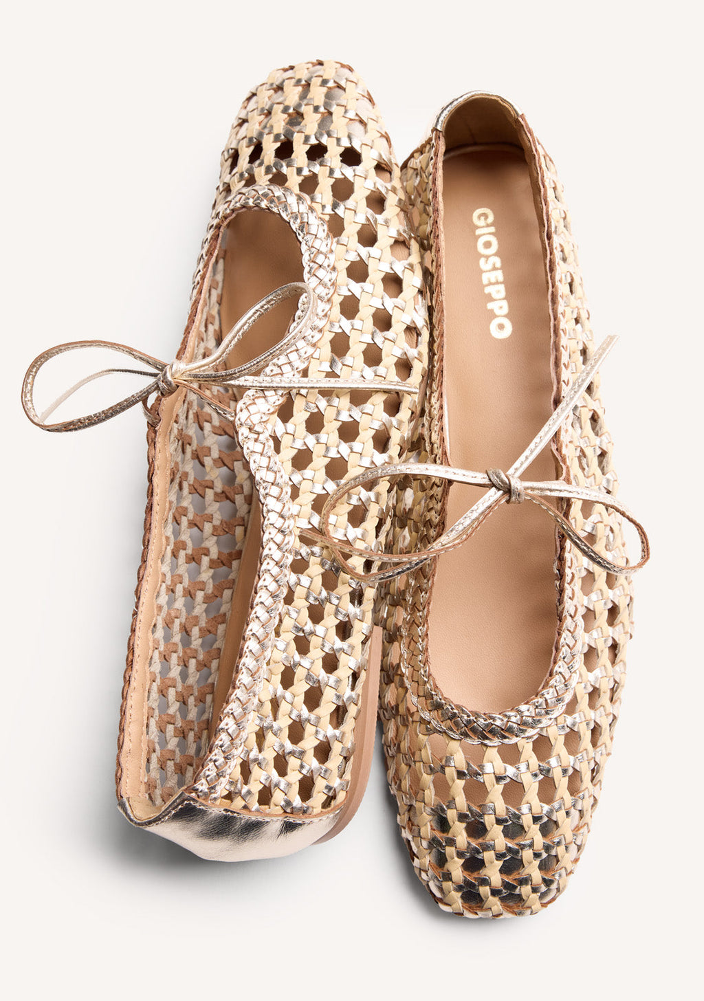 Gold woven ballet flats with ankle tie straps and low heels