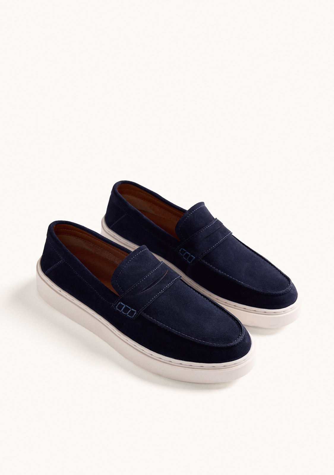 Men's navy loafers with penny strap and off-white platform sole