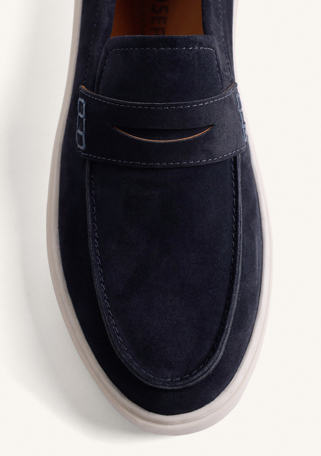 Men's navy loafers with penny strap and off-white platform sole