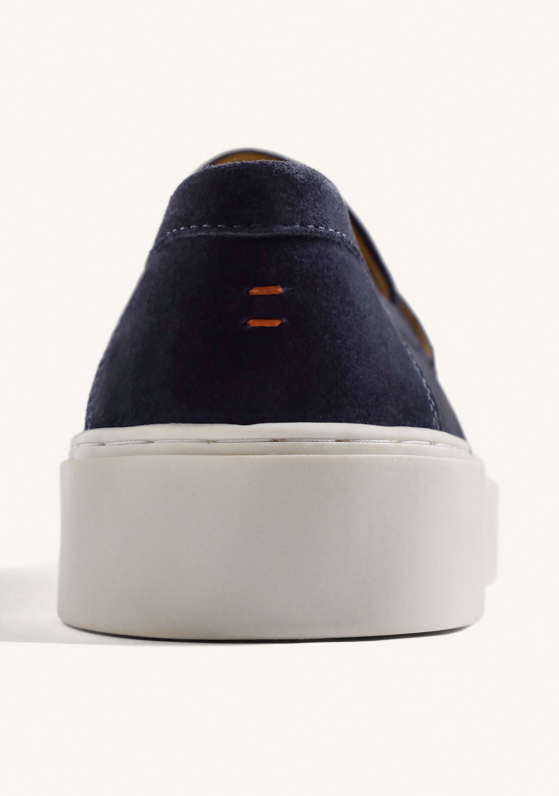 Men's navy loafers with penny strap and off-white platform sole