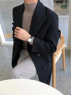 Men's long double-breasted overcoat with notched lapels and button fastening