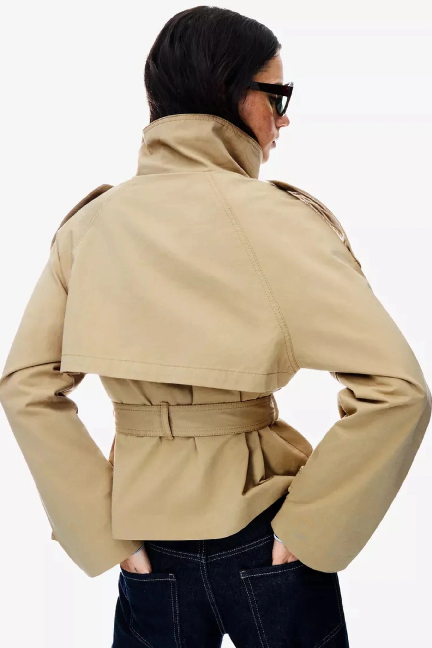 Women's cropped trench jacket with high collar, buttons, belt and shoulder tabs